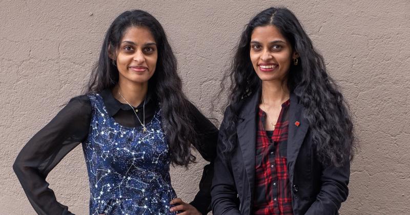 Sandhya and Swapna Mylabathula smile as they stand together.