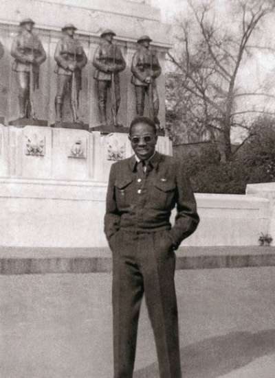 Leonard Braithwaite stands in uniform in front of the British War Memorial in London, England, shortly after V-E Day in 1945.