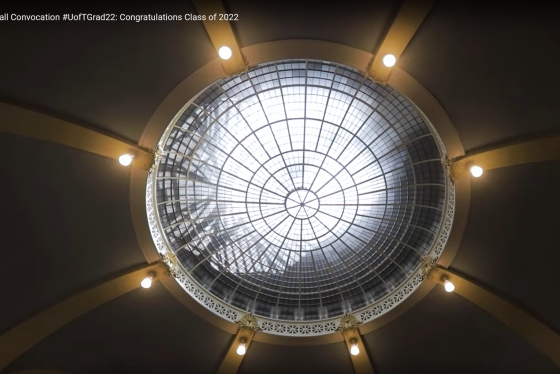Lights shine like stars around the bright oculus window in the ceiling of Convocation Hall.