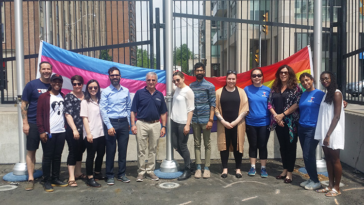 At Varsity Stadium on the downtown Toronto campus, the Trans flag was raised side-by-side with the Pride flag