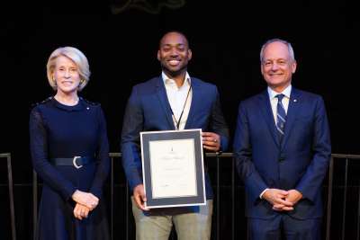 2019 winner Christopher Thompson holding their Arbor Award