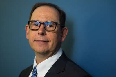 Portrait of Mark Lautens smiling.