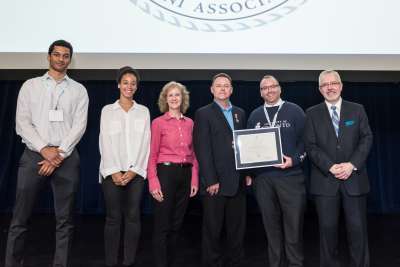 2019 Recipient Dr. Glen Sharpe, with UTAA President R. Scott MacKendrick and family of the late Carl Mitchell