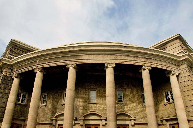 Close up of the external Convocation Hall with cloudy blue sky
