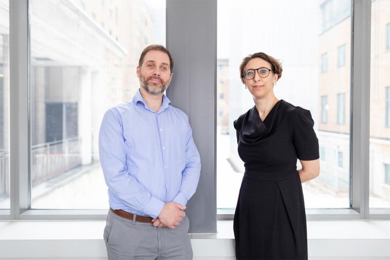 Robert Kozak and Samira Mubareka stand before a sunny window.