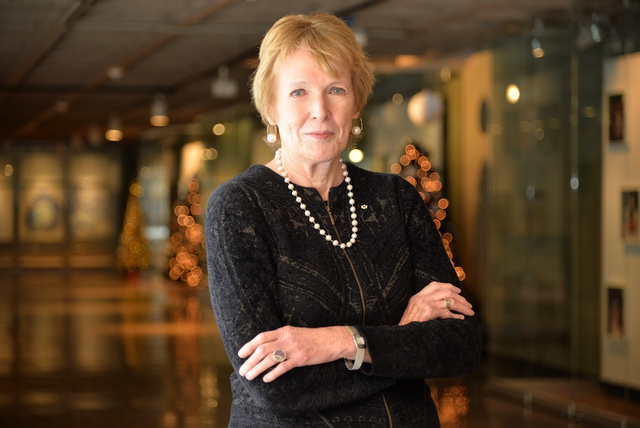 Margaret Macmillan smiling with her arms crossed