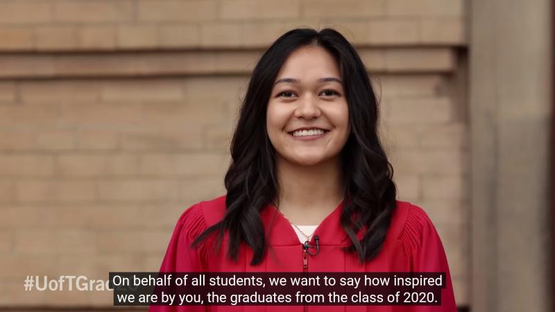 A student in academic robes smiles as she congratulates U of T's Fall 2020 graduates.