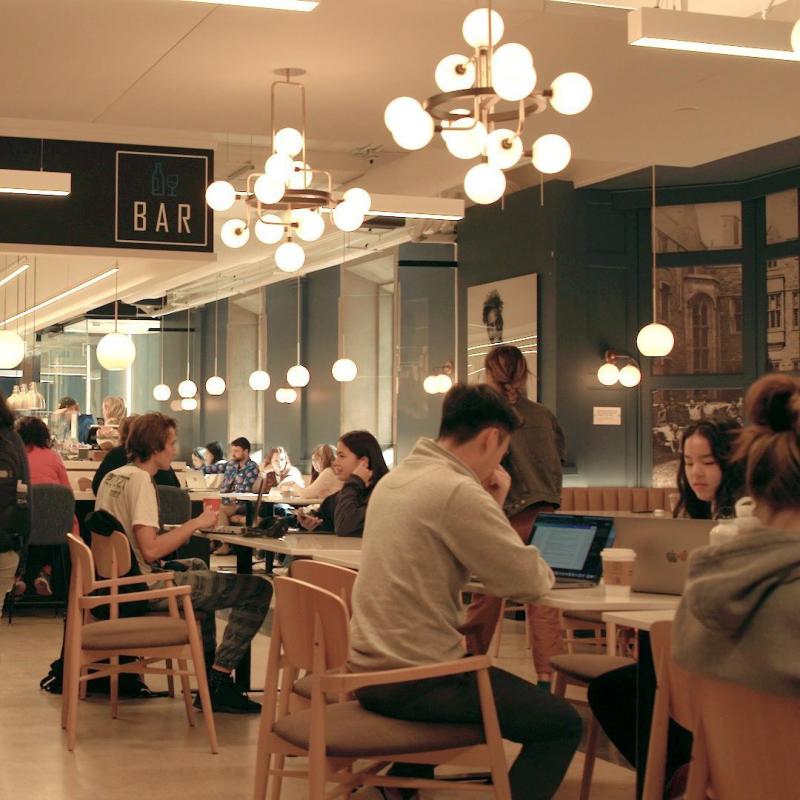 People sit at tables in the Arbor Room cafe at Hart House