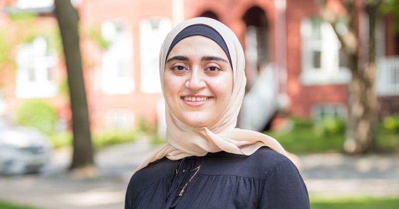 Atefeh Mohammadi stands outdoors, smiling.