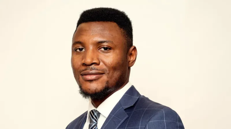 Headshot of entrepreneur Ifeanyi Eze-Onuorah wearing a suit and tie.
