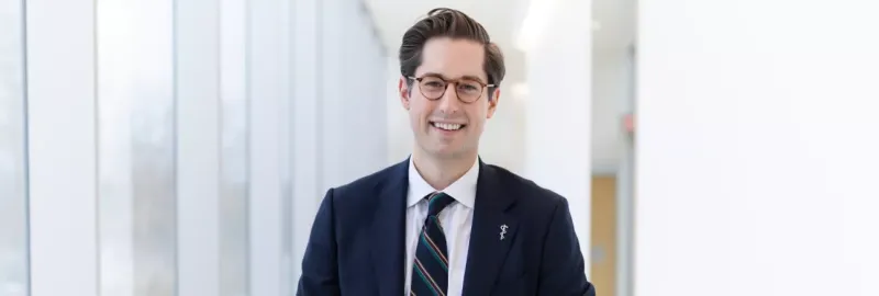 A portrait of Dr. Nowak wearing a suit and smiling