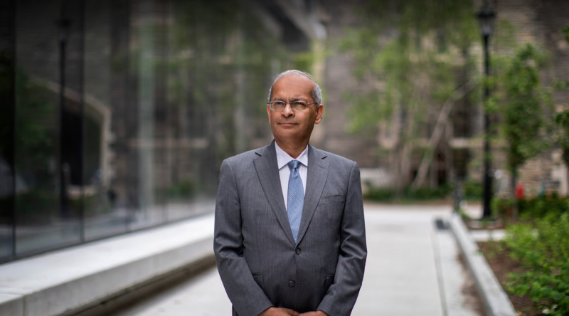 Vivek Goel stands outside hospitals on University Ave