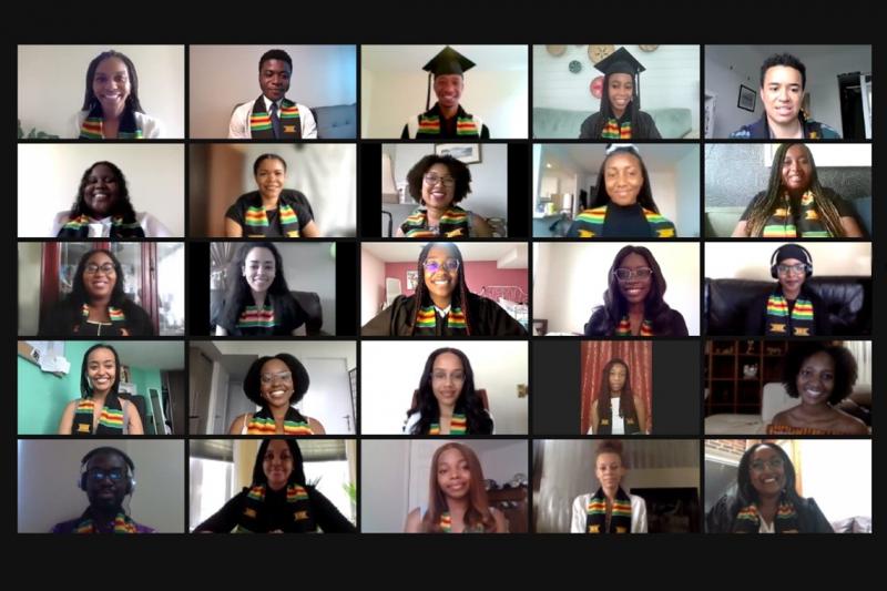 A grid of images of graduates on a video call. Each person wears a kente cloth reading: U of T Black Grad Class of 2021.