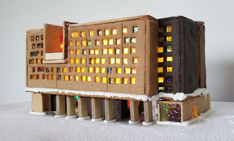 New College built from gingerbread features glowing sugar windows, wafer pillars, and snow icing.