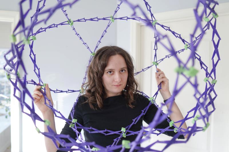 Kelly Lepo inside a bunch of purple wires