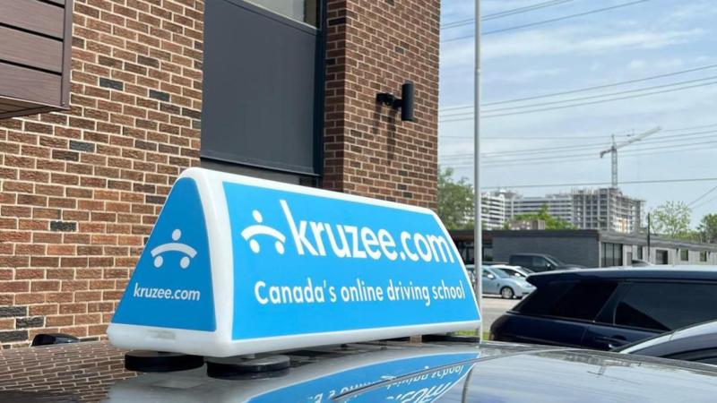The top of a car with a Kruzee sign on its roof