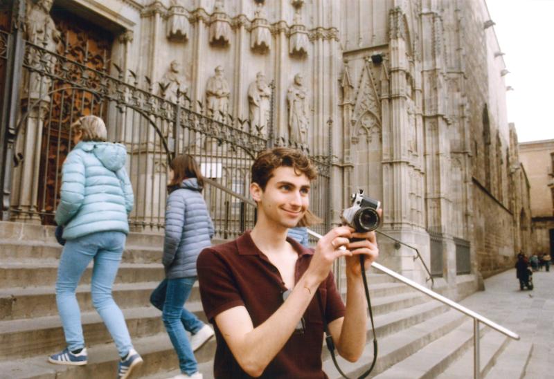 Phil Schwarz takes a photo while standing on the steps of the elaborate Sagrada Familia cathedral in Barcelona.