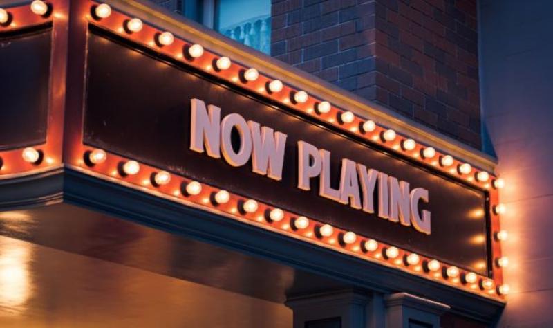 theatre signage that says "now playing"