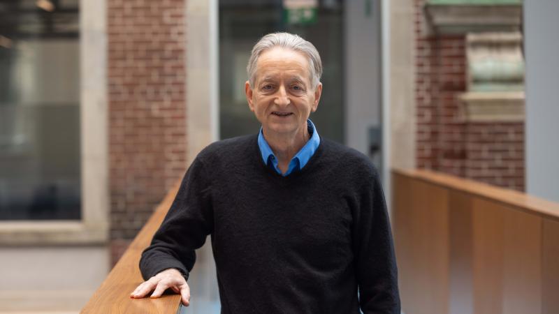 Prof. Hinton stands in a walkway in the Fitzgerald Building, U of T campus.