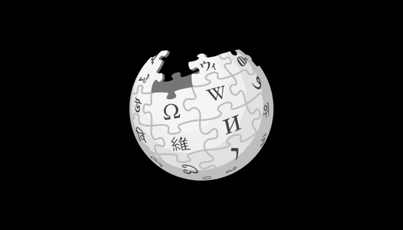 Black and white graphic of a globe made with puzzles pieces inscribed with symbols