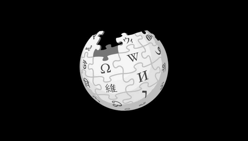 Black and white graphic of a globe made with puzzles pieces inscribed with symbols 