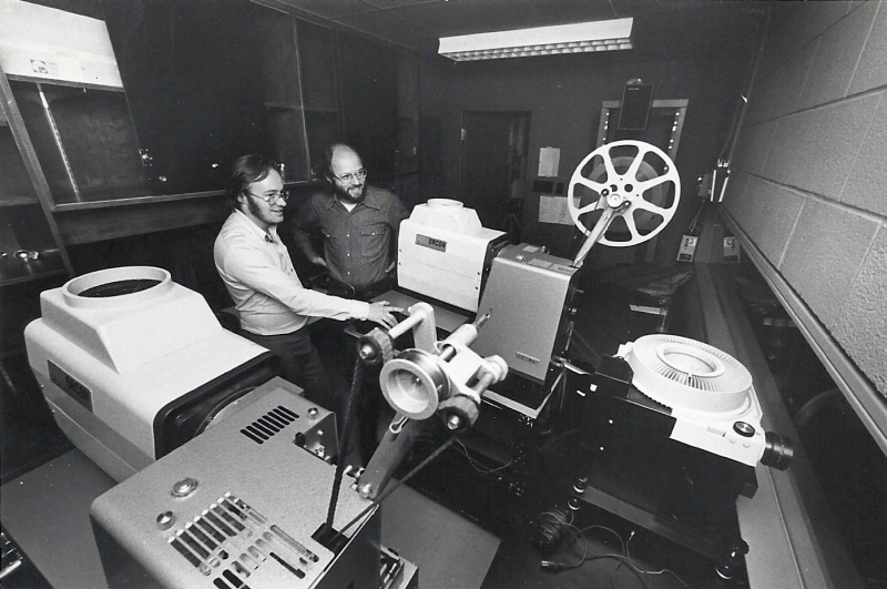 Innis Town Hall projection booth being operated by David Clanfield and Joe Medjuck.