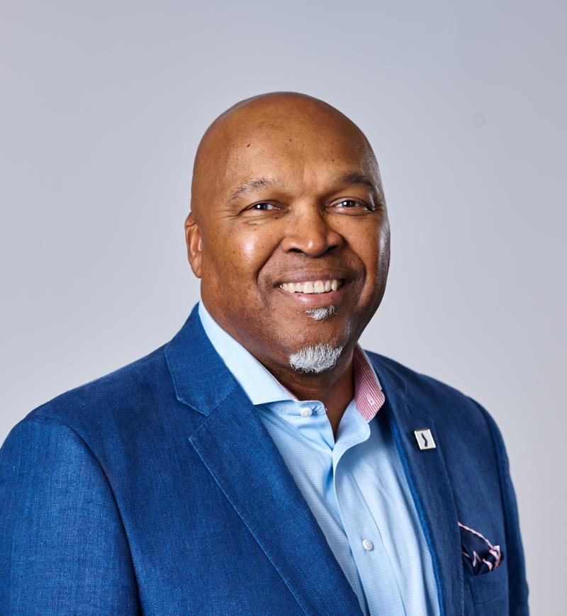 Portrait of Ray Williams, smiling at the camera