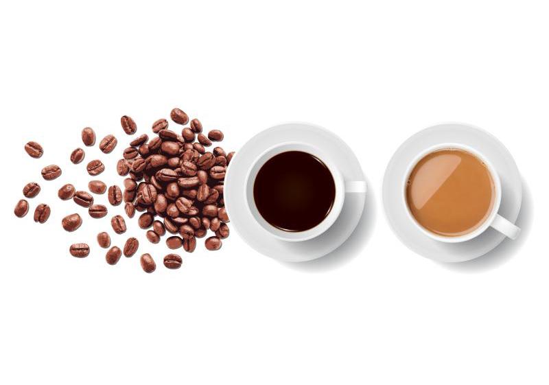 Coffee beans and two coffee cups.
