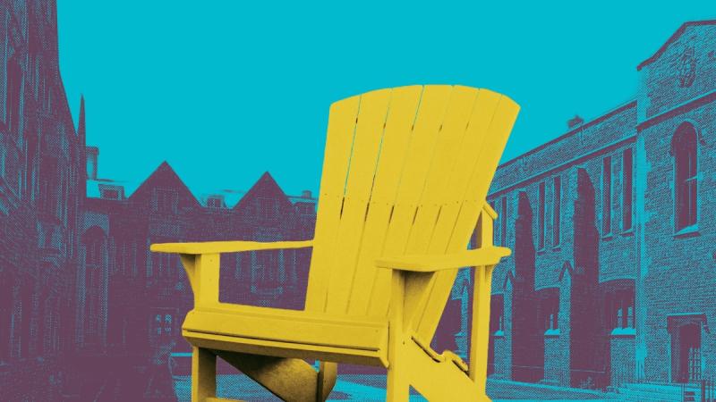 Brightly coloured Muskoka chair in the middle of the Hart House Quadrangle.