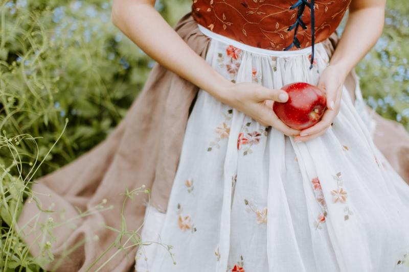 Person holding apple