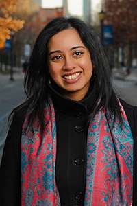 Portrait of Ananya Banerjee smiling.