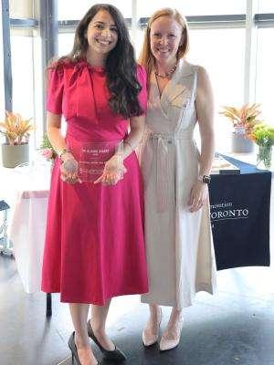 Anureet standing with Claire holding the award