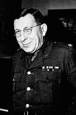 Frederick Banting wears a military uniform with medal bars on the chest.