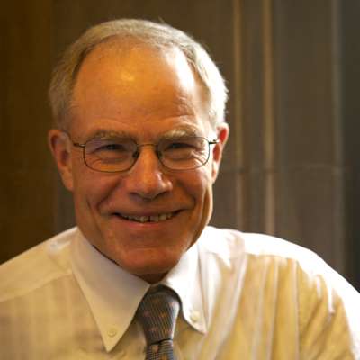 Portrait of Bruce Kidd smiling.