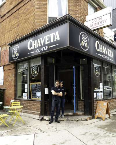 Michelle and Julian standing outside their coffee shop