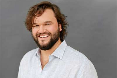 Portrait of Matthew Cairns smiling.