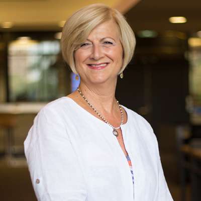 Portrait of Carol Rolheiser smiling.