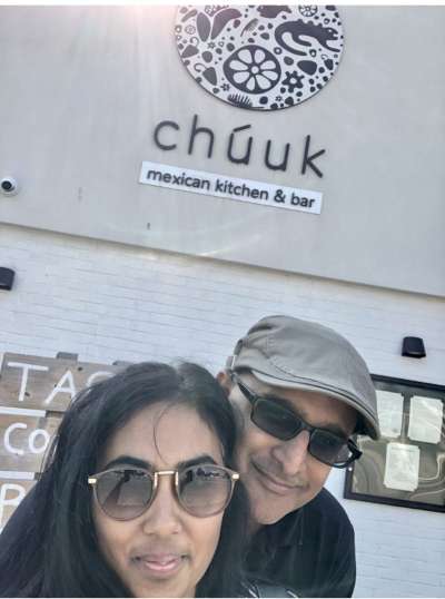 Cynthia and Anil standing in front of Chuuk restaurant