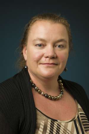 Portrait of Janet Ellis smiling slightly.