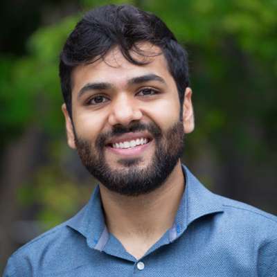 Portrait of Kramay Patel smiling.