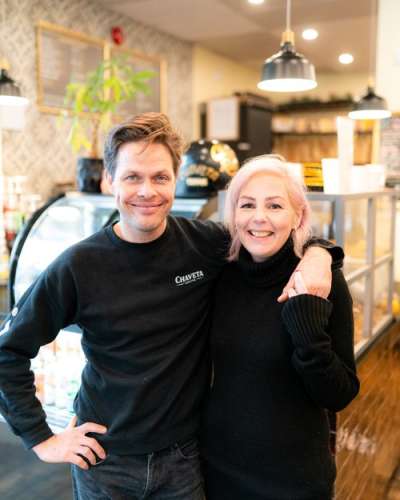 Michelle and Julian standing in their coffee shop