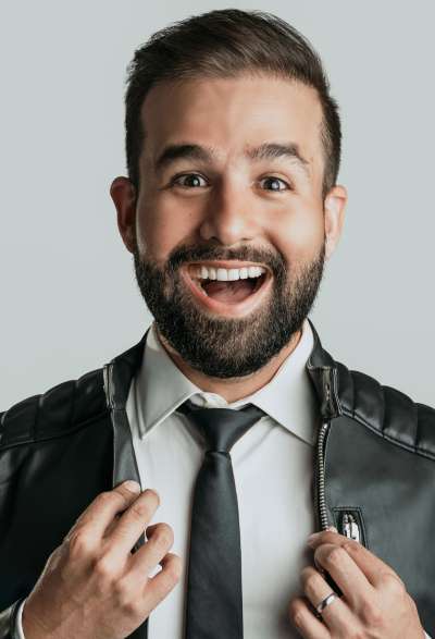 Speaker, Stephan Dyer, white man, shown in portrait with big smile.