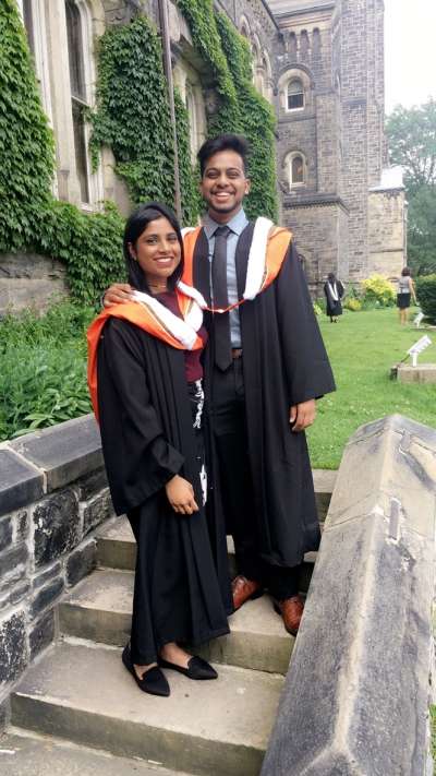 Trina and Cal on graduation day, in their robes.