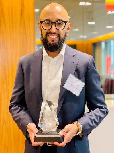 Yusuf Zakir holding a trophy