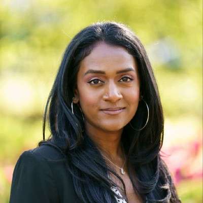 Portrait photo of Vandana Fatima Kattar smiling.