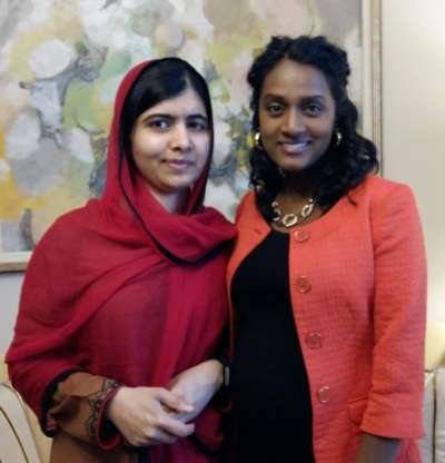 Malala Yousafzai and Vandana Fatima Kattar standing together.