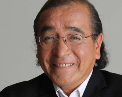 Photo of Tomson Highway smiling.