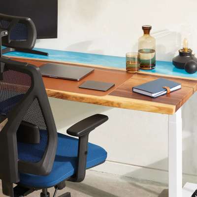 An office chair pulled up to a desk