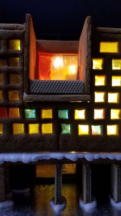 A close up of the sugar stained glass windows with light behind them.