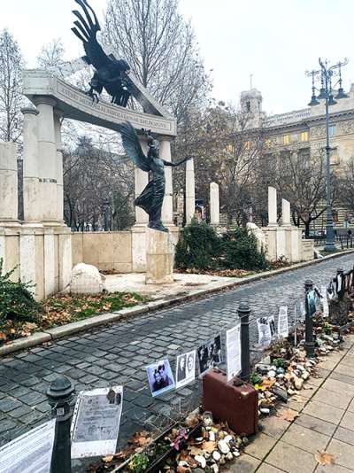 A memorial area with stones and pictures